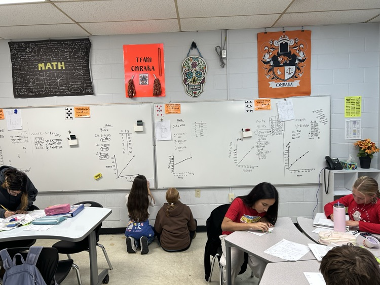 students at whiteboard