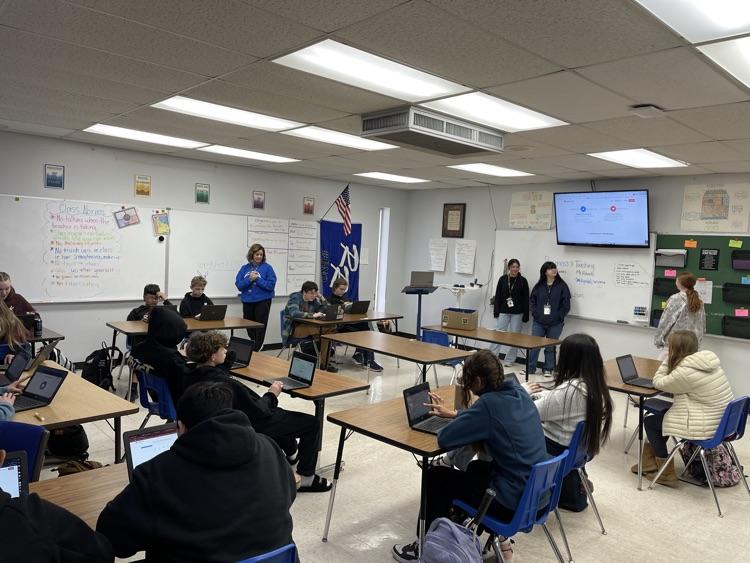 HS students sharing ideas with 8th graders. 