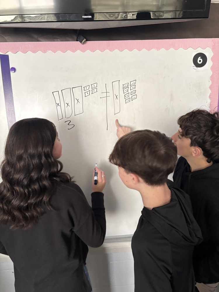 students at whiteboard