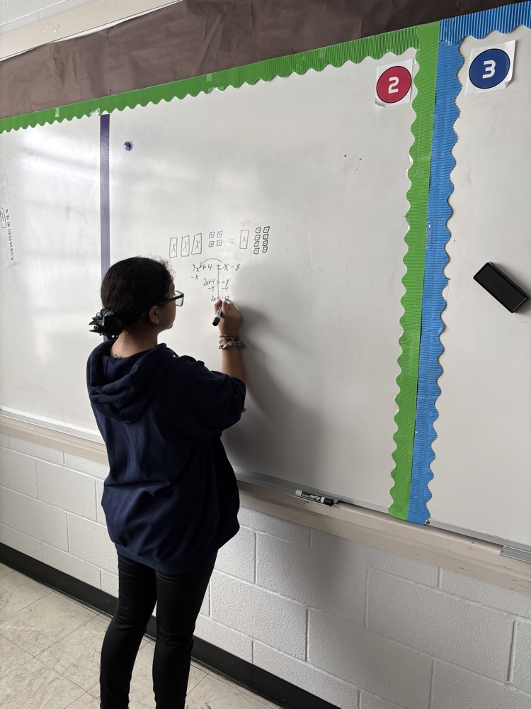 student at whiteboard