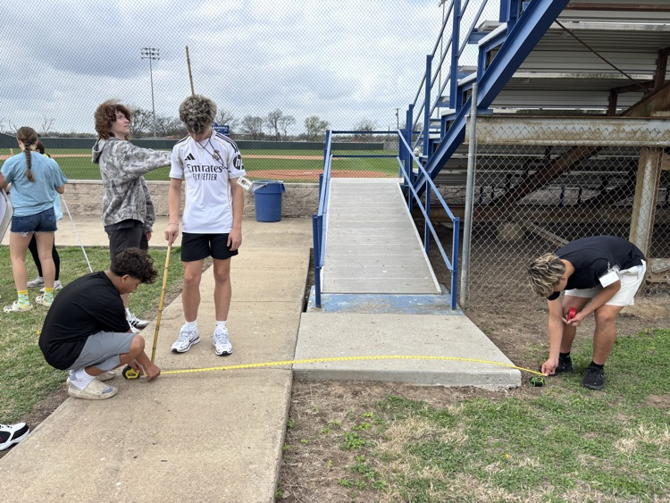 Coach Snow's geometry class used similar triangles to indirectly measure the baseball bleachers.