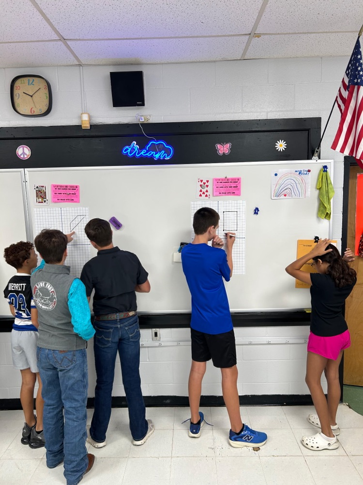 students at whiteboards