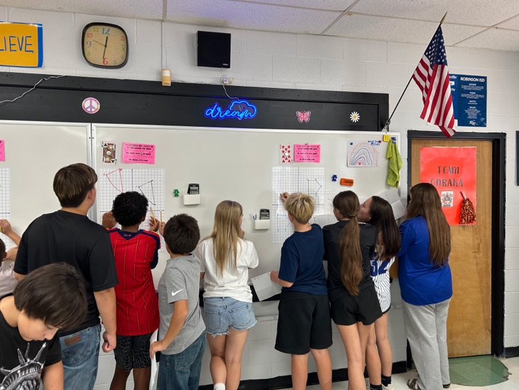 students at whiteboards