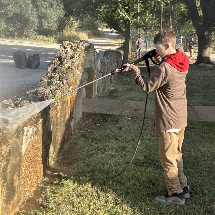 Power washing the old rock wall!