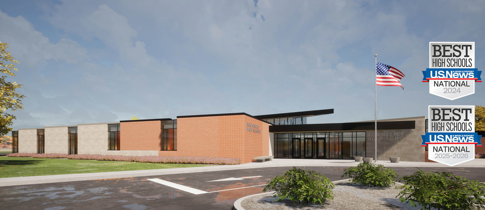 Exterior view of Rochester High School with an American flag waving in the wind.