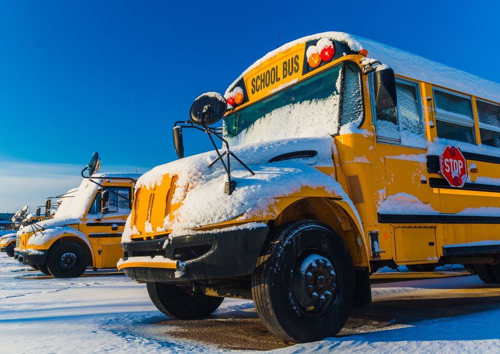 School bus covered in snow