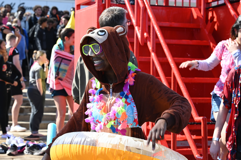 Student is all similes in her monkey onsie and intertube after plunging.