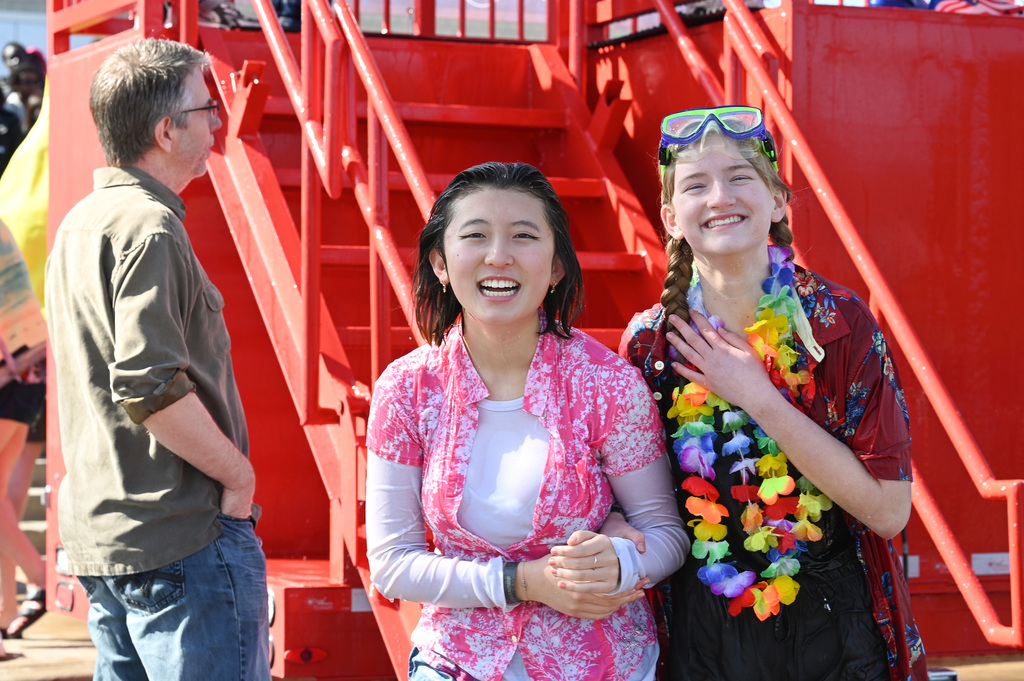Students pose together after climbing down the stairs.