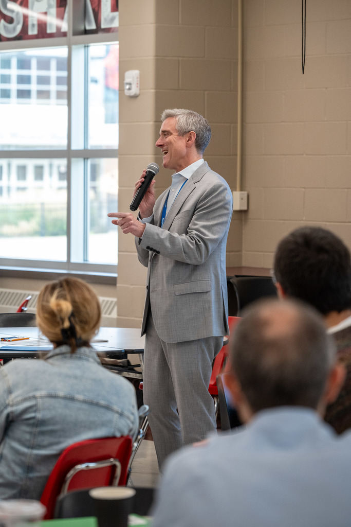 Superintendent Kent Pekel addresses new teachers in John Marshall High School Cafeteria.