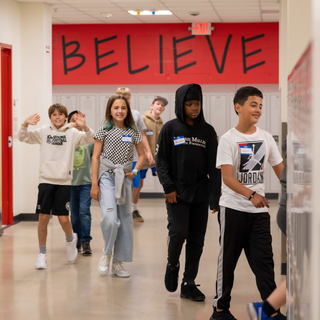 John adams middle school students walking into class.