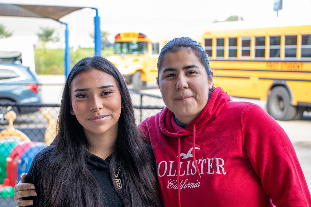 Parent and a student posing for a photo at the RALC.