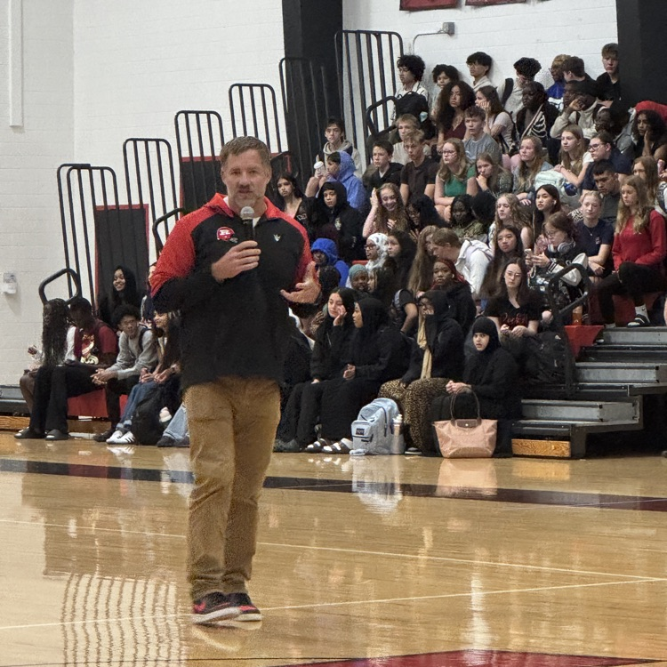 Principal Ruzek talking at pep fest