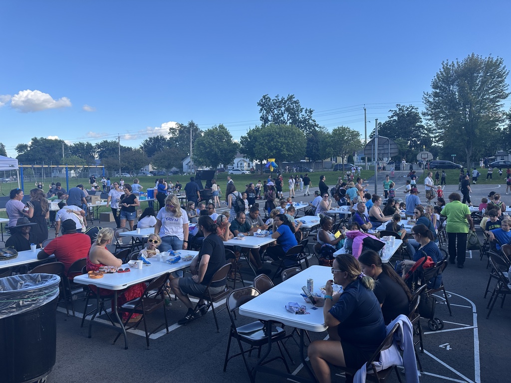 Families sitting at picnic tables
