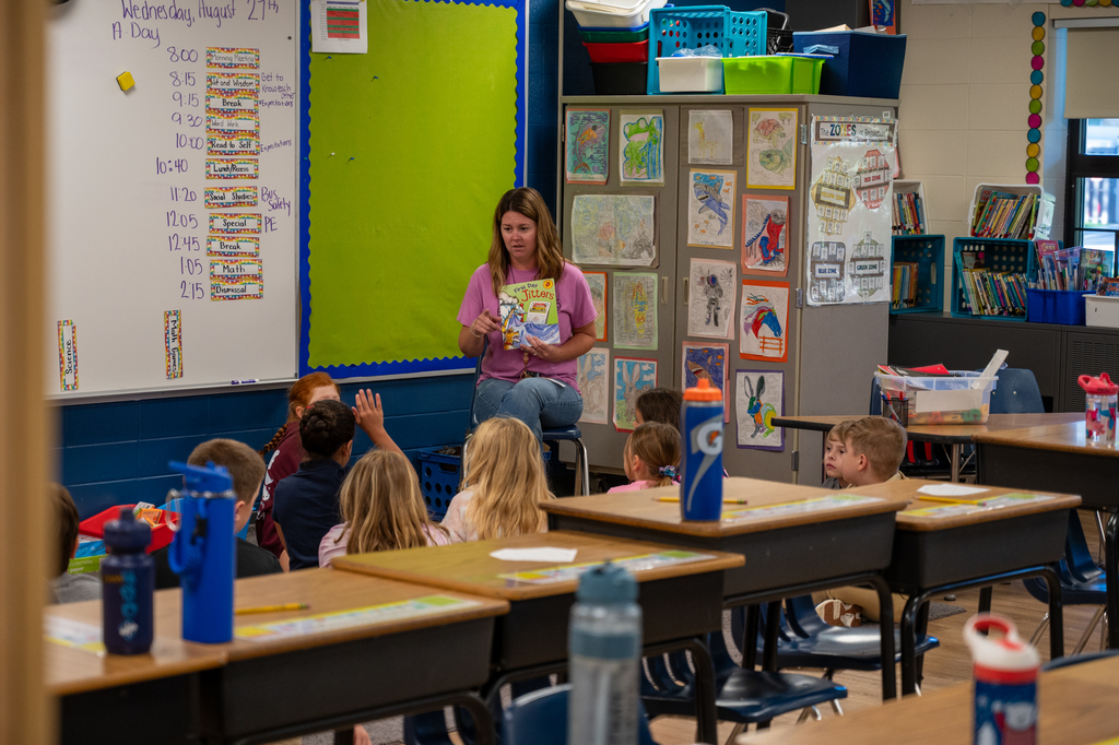 A teacher reading to her class