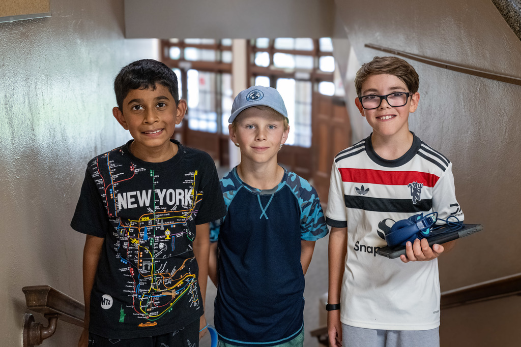 Three friends smiling at the camera