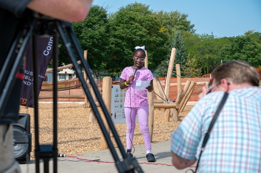 Franklin student speaks in front of her classmates and media about how the new playground will help her and her classmates grow