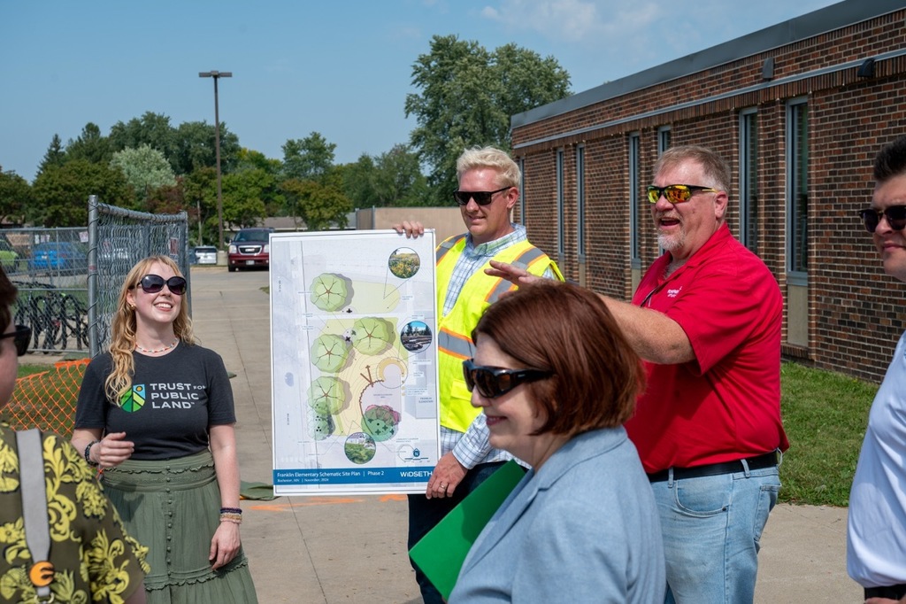 Community members discuss future plans for the playground