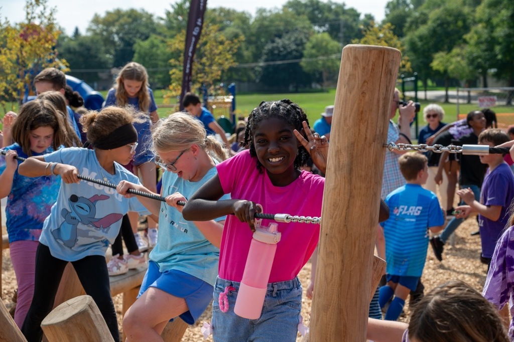 Franklin Student poses on the new playground