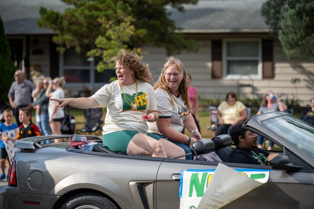 MHS Nurse Becky and Nurse Caitlin ride in a convertable