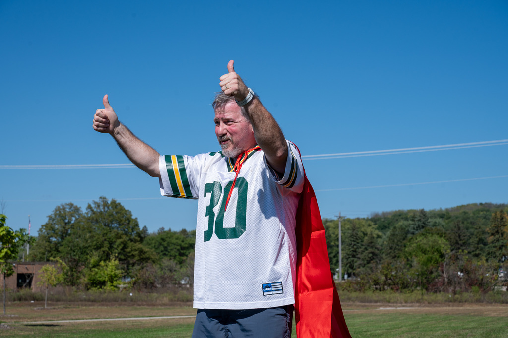 Longfellow teacher gives a thumbs up before he gets initiated into the challenge