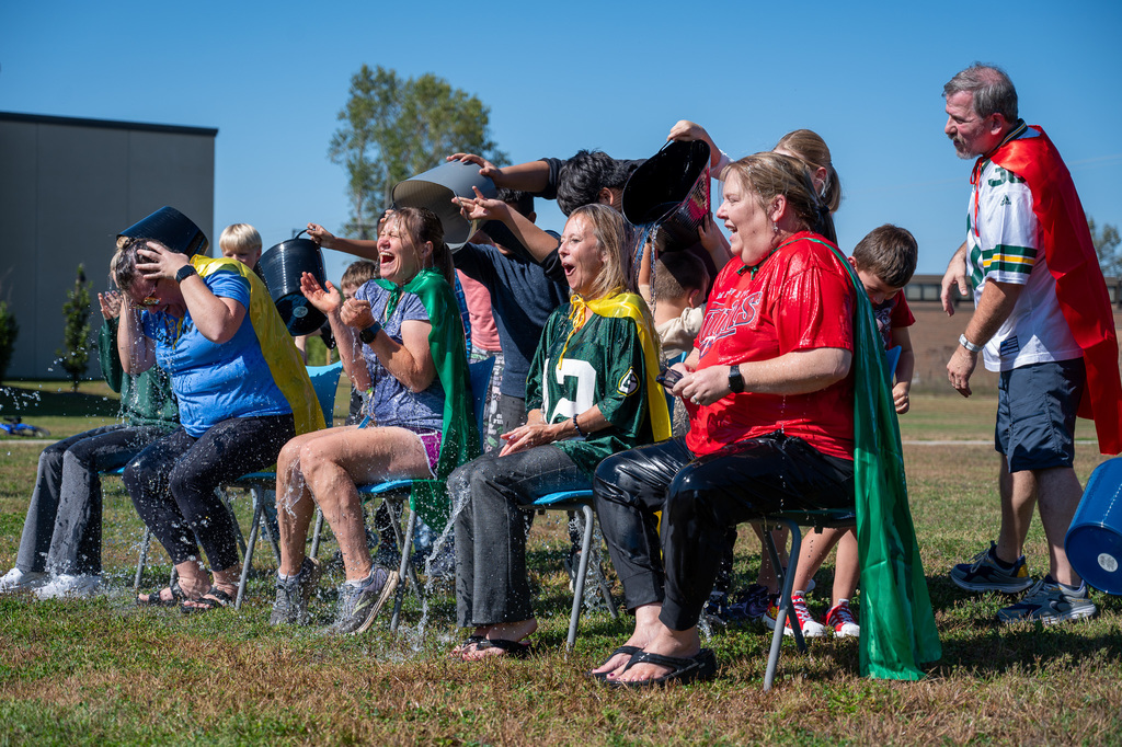 Longfellow teachers get ice water poured on them to help raise money for the Alzheimer's Association