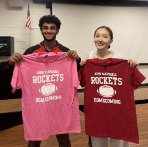 Students holding Homecoming Shirts for Sale