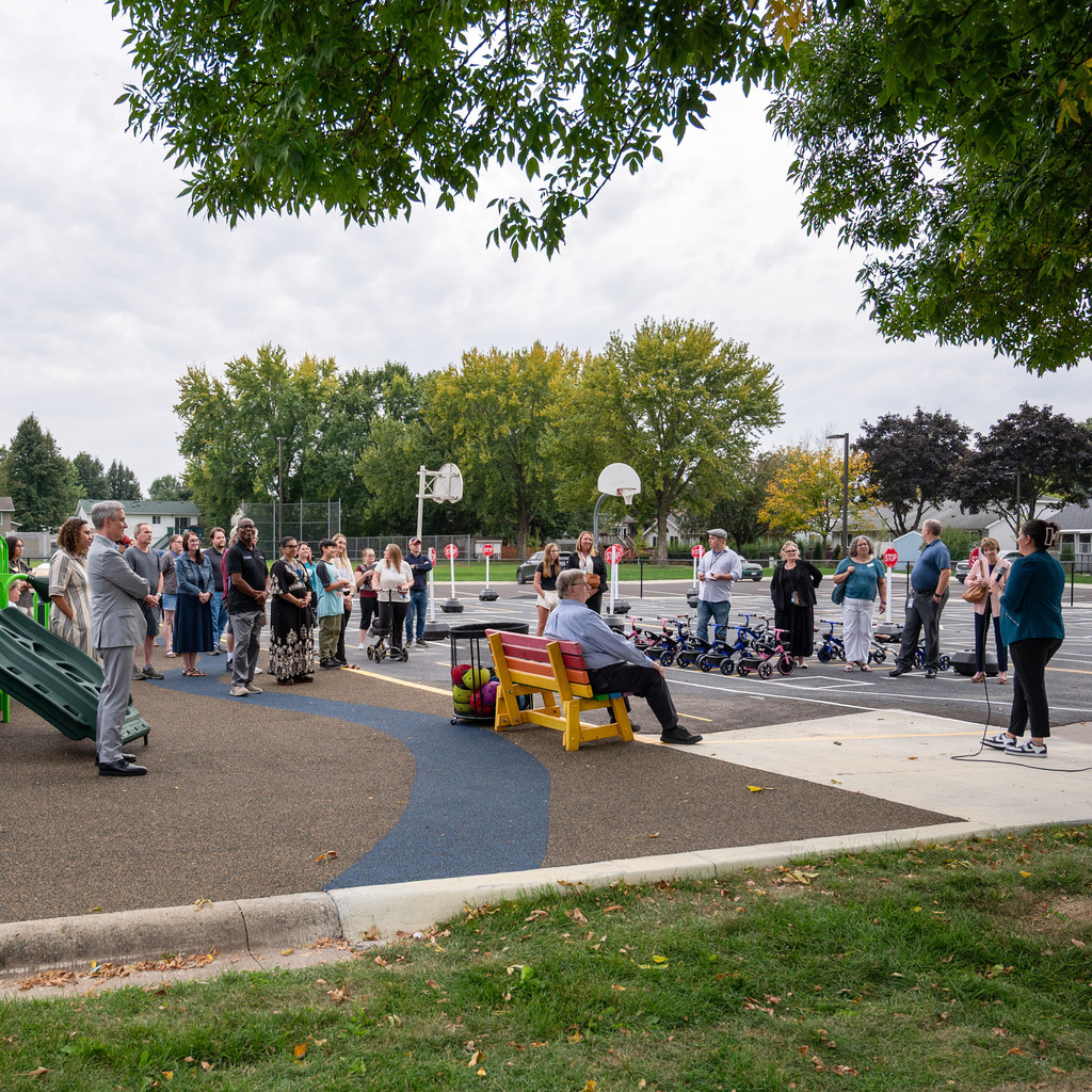 Group gathers to celebrate the opening of Mighty Oaks Early Learning School 's new location.