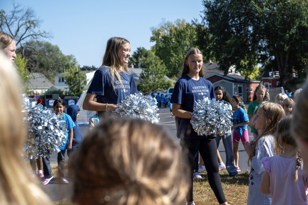 Century cheerleaders showing students cheers