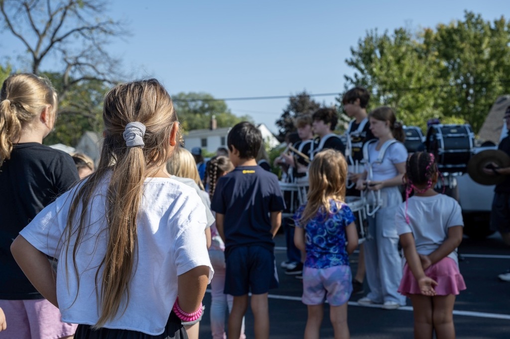 Students watch the drumline play