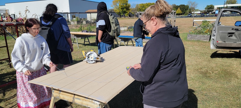 ALC Youth Build students working on a shed