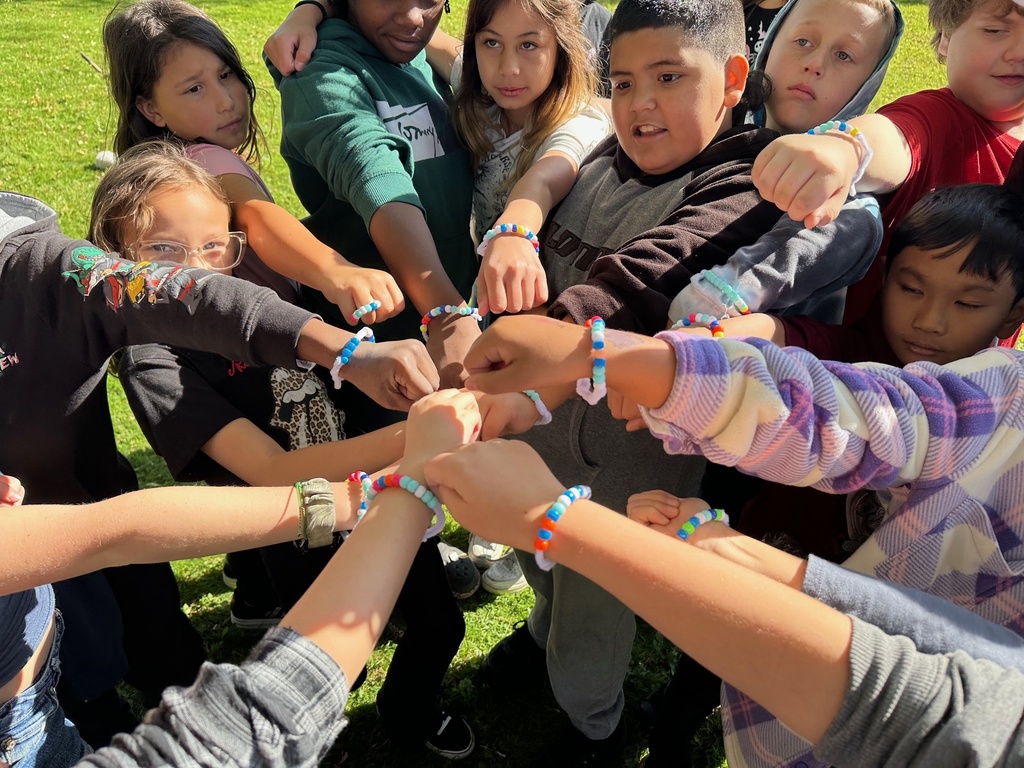 Kids putting hands together