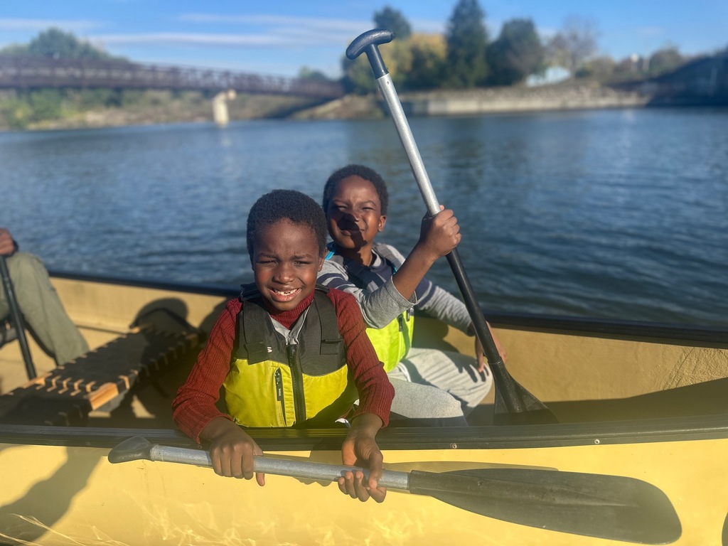 Two kids in a canoe