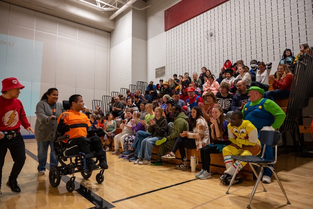 Jacob is cheered on by his classmates after dancing to “This Is How We Roll” by Florida Georgia Line with his teacher, Brisa