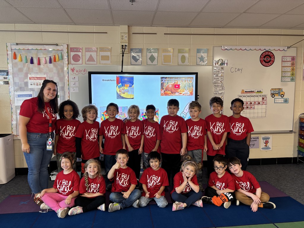 Kindergartner's wearing red Be Kind t-shirts.
