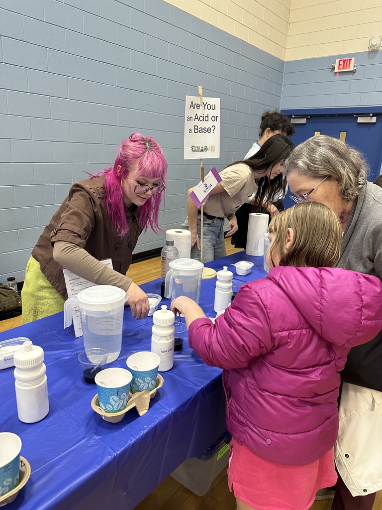 Teacher helping student