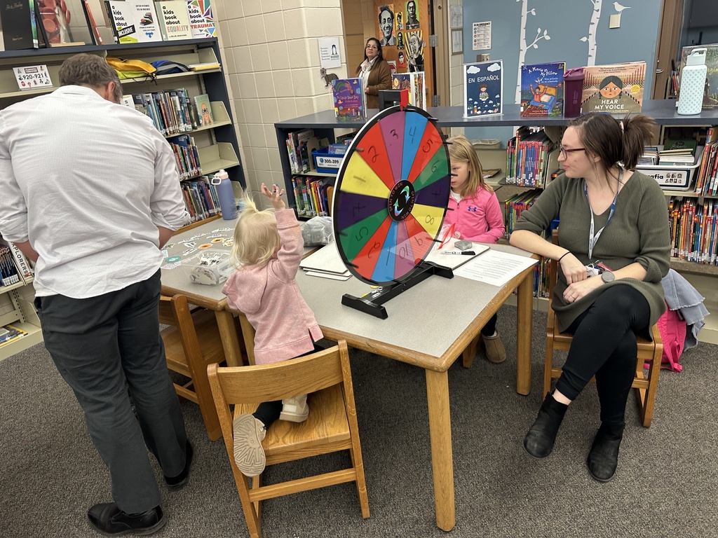 Teacher near table with children
