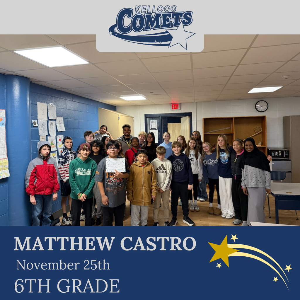 classroom of students in multicolored clothing, student in middle holding certificate for student of the week