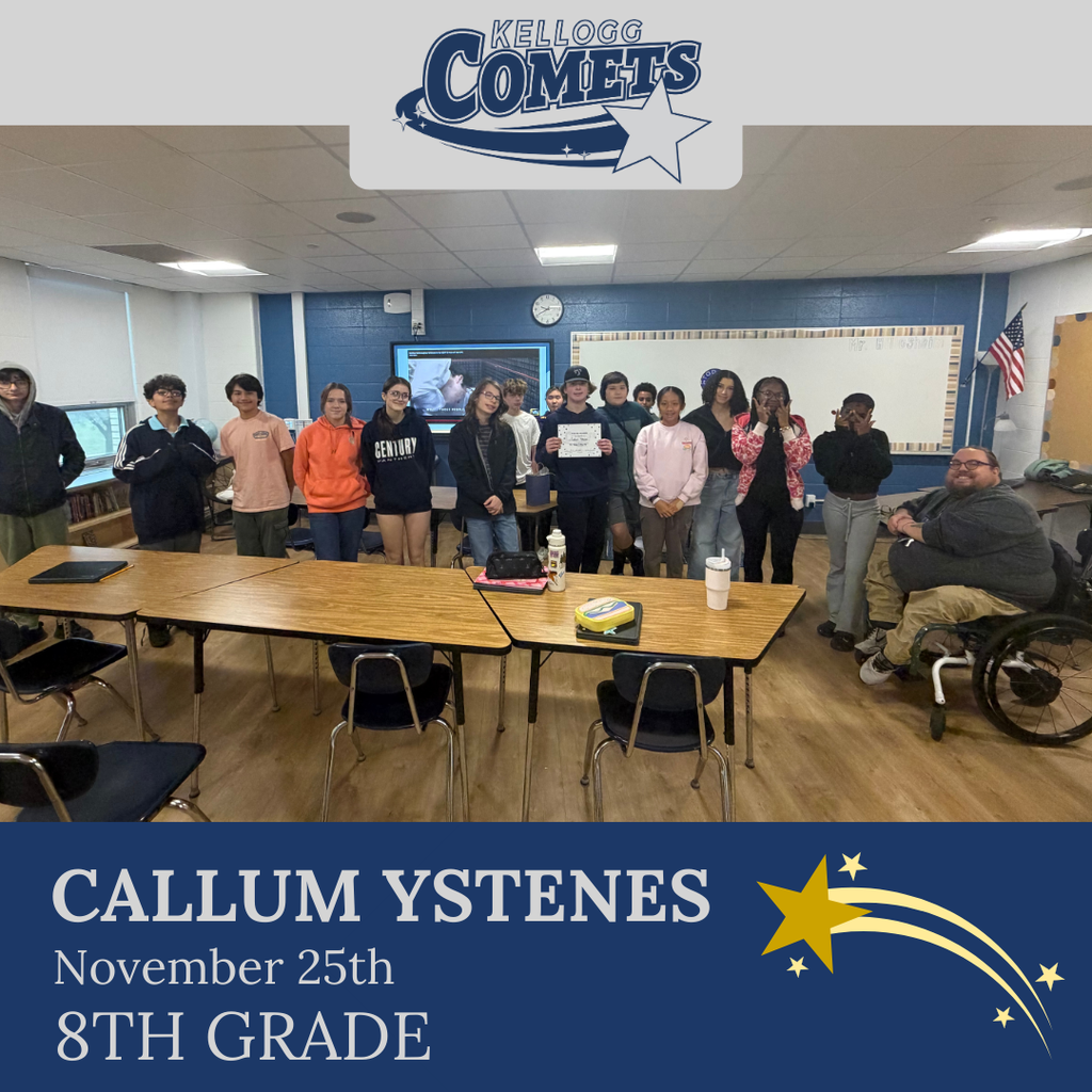 classroom of students in multicolored clothing, student in middle holding certificate for student of the week
