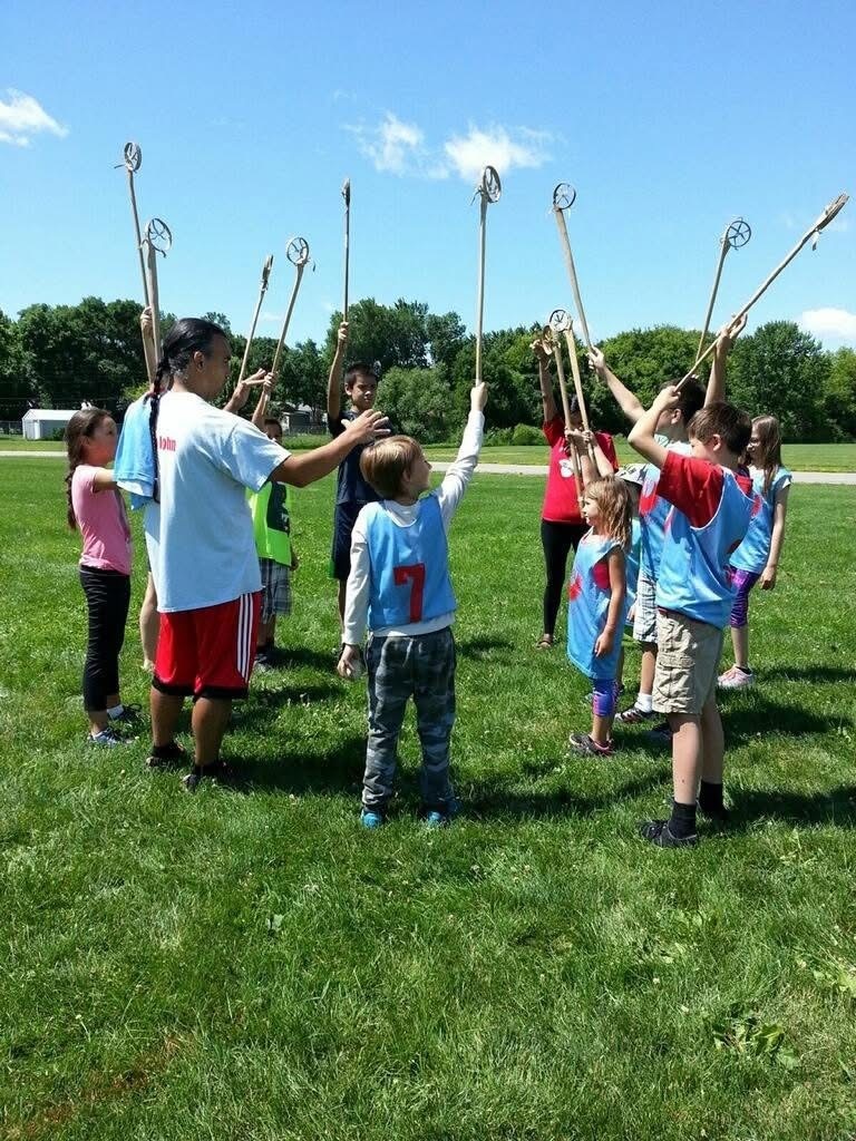 AIE students learning about Lacrosse