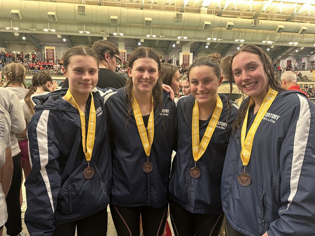 Century swim team posing with metals