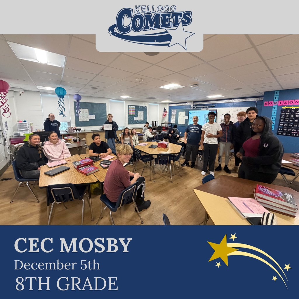 classroom of students in multicolored clothing, student in middle holding certificate for student of the week