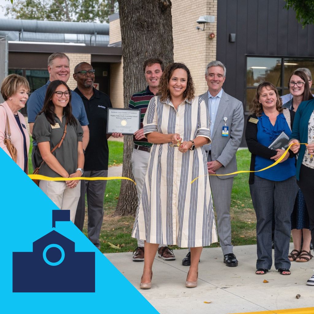 Director of Early Childhood cutting the ribbon for the Mighty Oaks early learning school's new location.