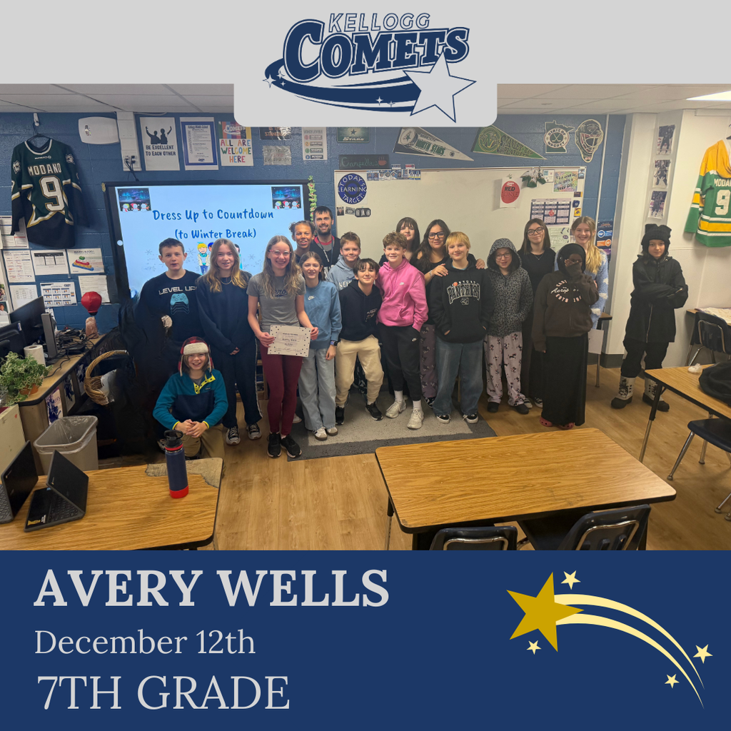 classroom of students in multicolored clothing, student in middle holding certificate for student of the week