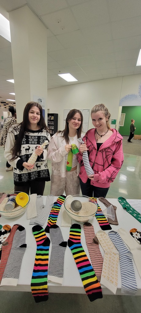 Students make DIY cold/heat packs out of rice and socks.