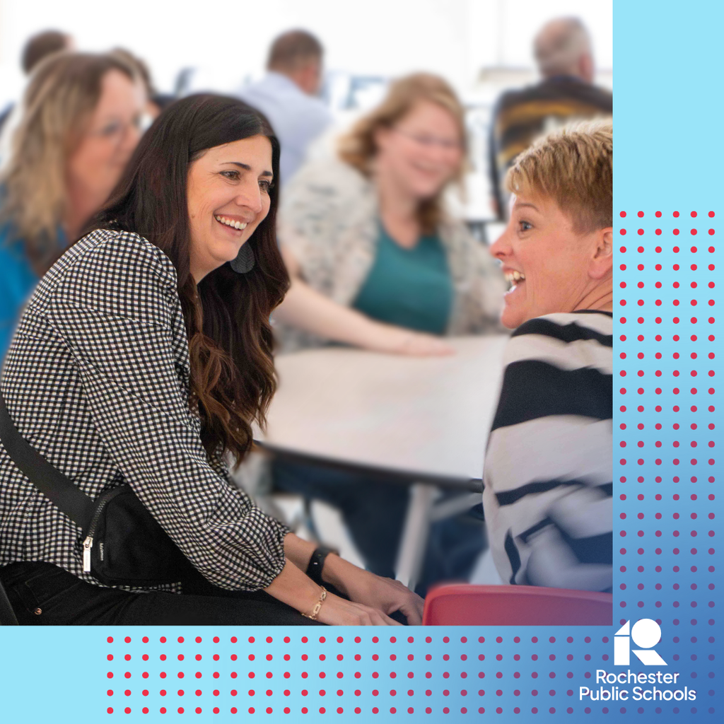 Two RPS staff members laughing at the conversation in new teach orientation.