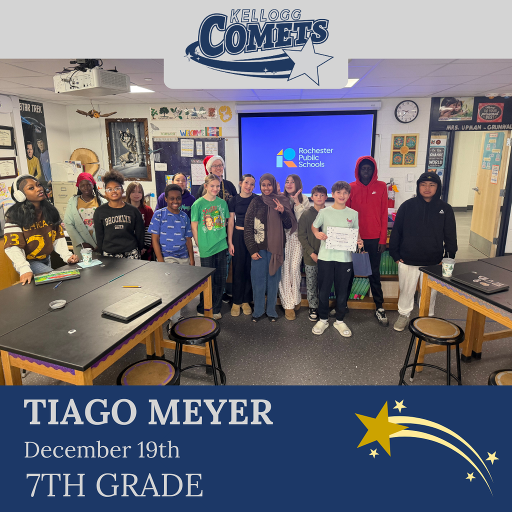 Group of students in multicolored clothing standing and smiling for a student who received award