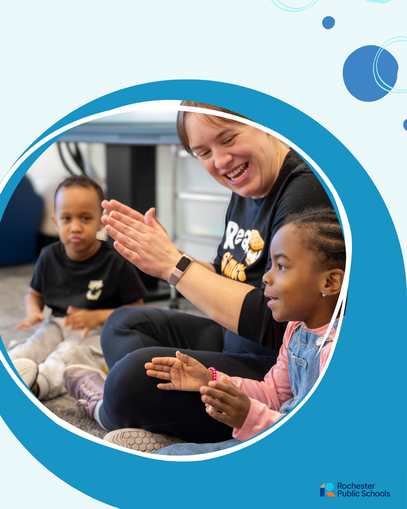 Teacher and students clapping along to a song. Rochester Public Schools logo.