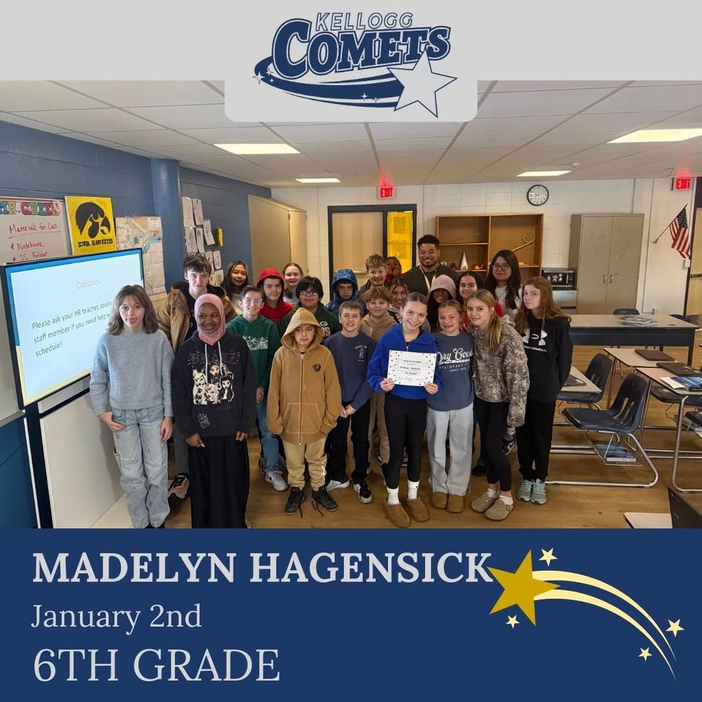 Group of students in multicolored clothing standing and smiling for a student who received award