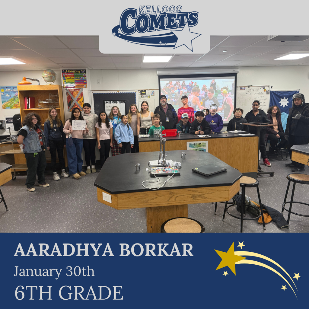 Group of students in multicolored clothing standing and smiling for a student who received award