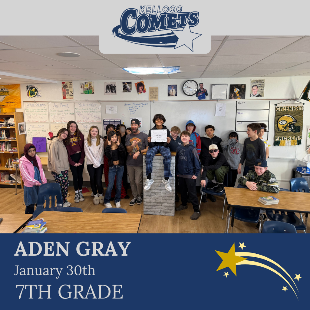 Group of students in multicolored clothing standing and smiling for a student who received award